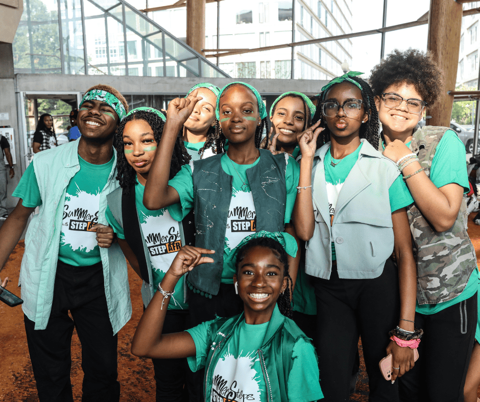 Summer Steps with Step Afrika!'s Green Team poses for a photo before the culminating performance