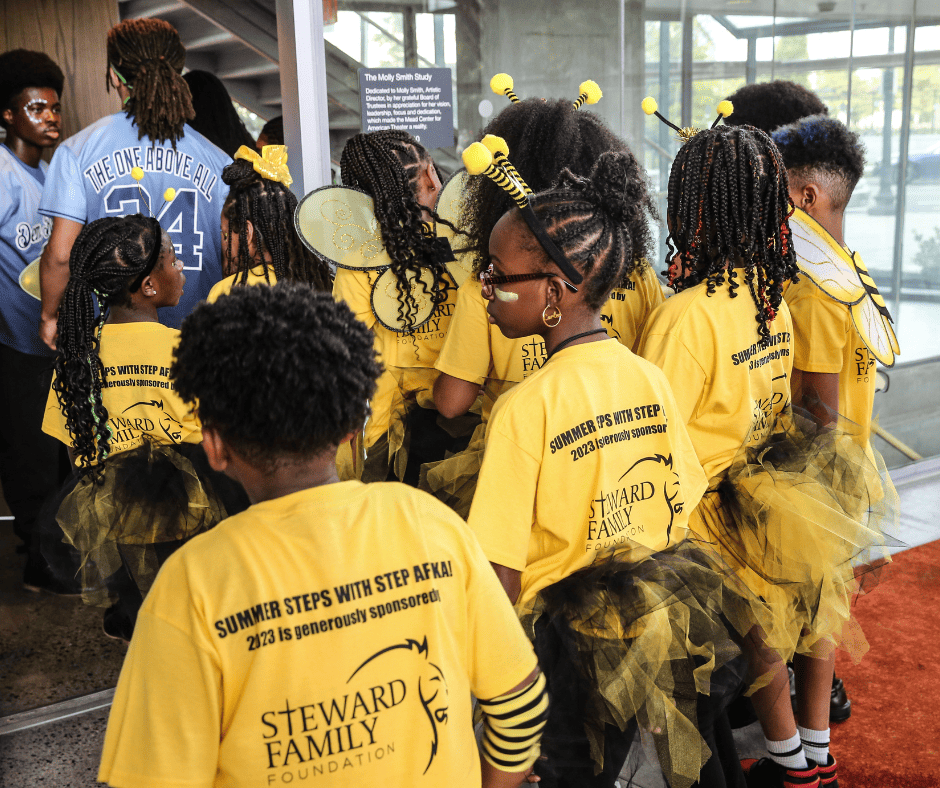 The Stewart Family Foundation is displayed proudly on the backs of Summer Steps with Step Afrika!'s Yellow Team t-shirts.