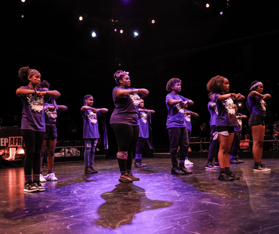Summer Steps with Step Afrika!'s Purple Team performing during the culminating step show.